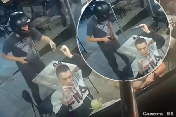 (VIDEO) PA OVAJ MOMAK JE TOTALNI CAR! Dok PLJAČKAŠ preti pištoljem on mrtav hladan jede PILEĆA KRILCA!