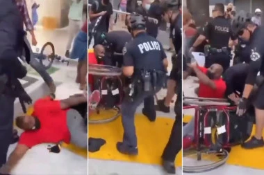 UŽAS NA ANTIVAKSERSKOM PROTESTU U AUSTRALIJI! 6 policajaca tuče invalida u kolicima (VIDEO)