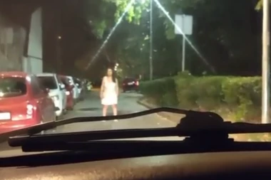 KAO IZ HOROR FILMOVA! Žena u belom stoji nepomično ispred automobila i gleda vozača! Jeziva scena u Beogradu 2 sata posle ponoći! (VIDEO)