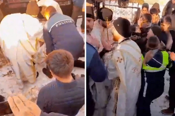 SVEŠTENIK LEGAO ISPRED KAPIJE GROBLJA, PA POKUŠAO DA ZAUSTAVI SAHRANU: Bizarna scena zabeležena je u Rumuniji, evo koji je razlog što je to učinio! (VIDEO)