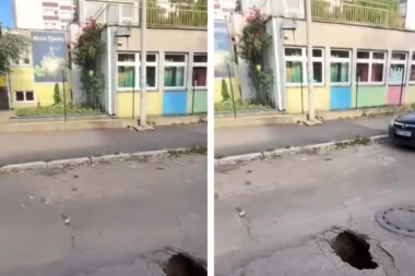 DETE, BEZ PROBLEMA, U NJU MOŽE DA UPADNE! Pogledajte kolika se rupa otvorila na kolovozu ispred vrtića u Zemunu! (FOTO)