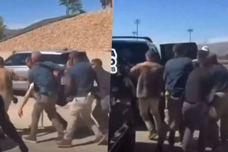 JEZIVO, ŠESTORICA GA POLUMRTVOG NOSE! Pogledajte snimak unošenja ranjenog Kirka u automobil! MASA OKOLO USPANIČENO VRIŠTI, POLICIJA SE DERE "STOP"! (VIDEO)